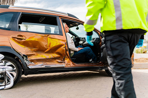 Paramedic assisting injured accident victim